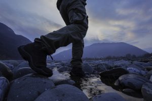 Hiker crossing river